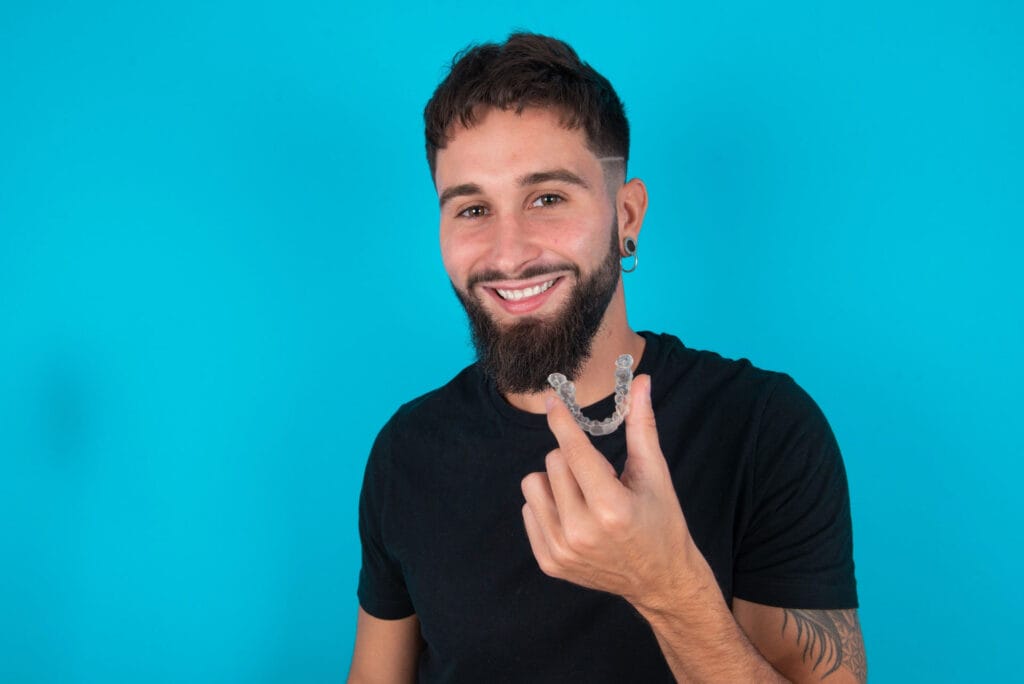 Patient wearing Invisalign clear aligners at Carlsbad Shores Dentistry in Carlsbad, CA