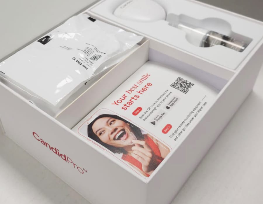 CandidPro starter kit with aligner accessories and welcome instructions inside the box